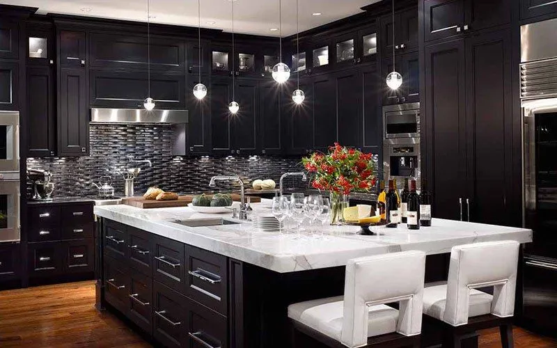 Dark kitchen cabinets with a white island installed in a Brecksville Ohio kitchen