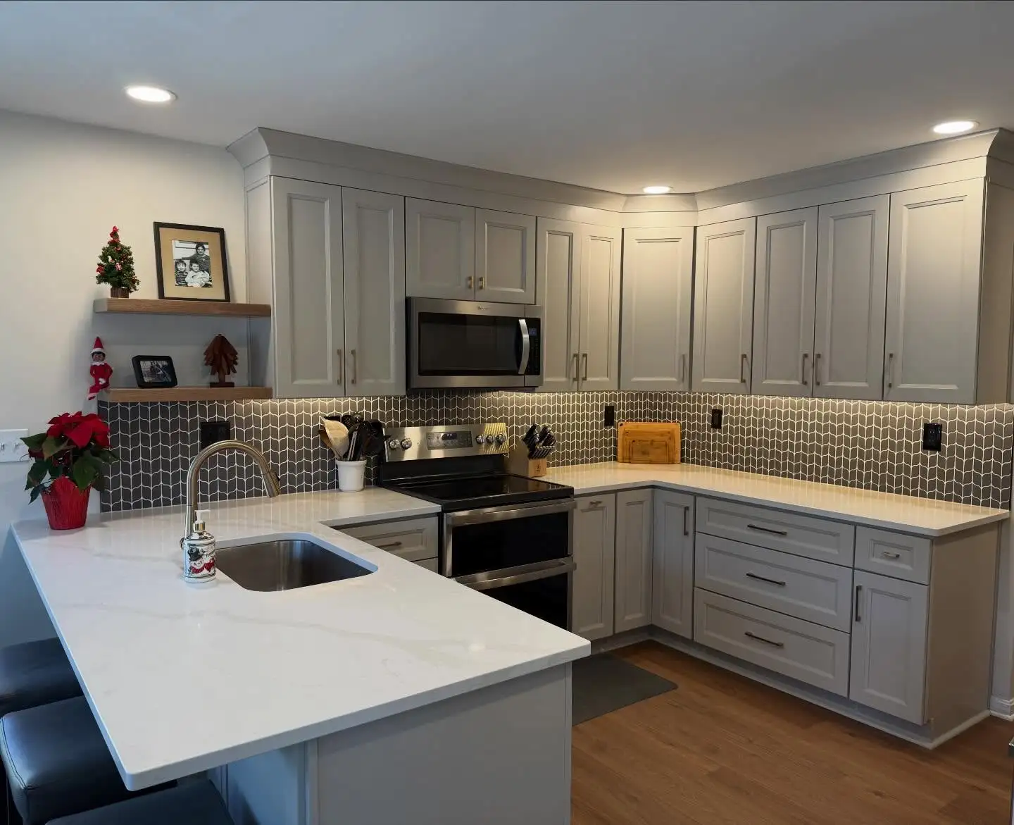 Light grey kitchen cabinets with a peninsula in a Wickliffe Ohio home