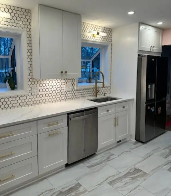 White kitchen cabinets with light flooring in a Beachwood Ohio kitchen