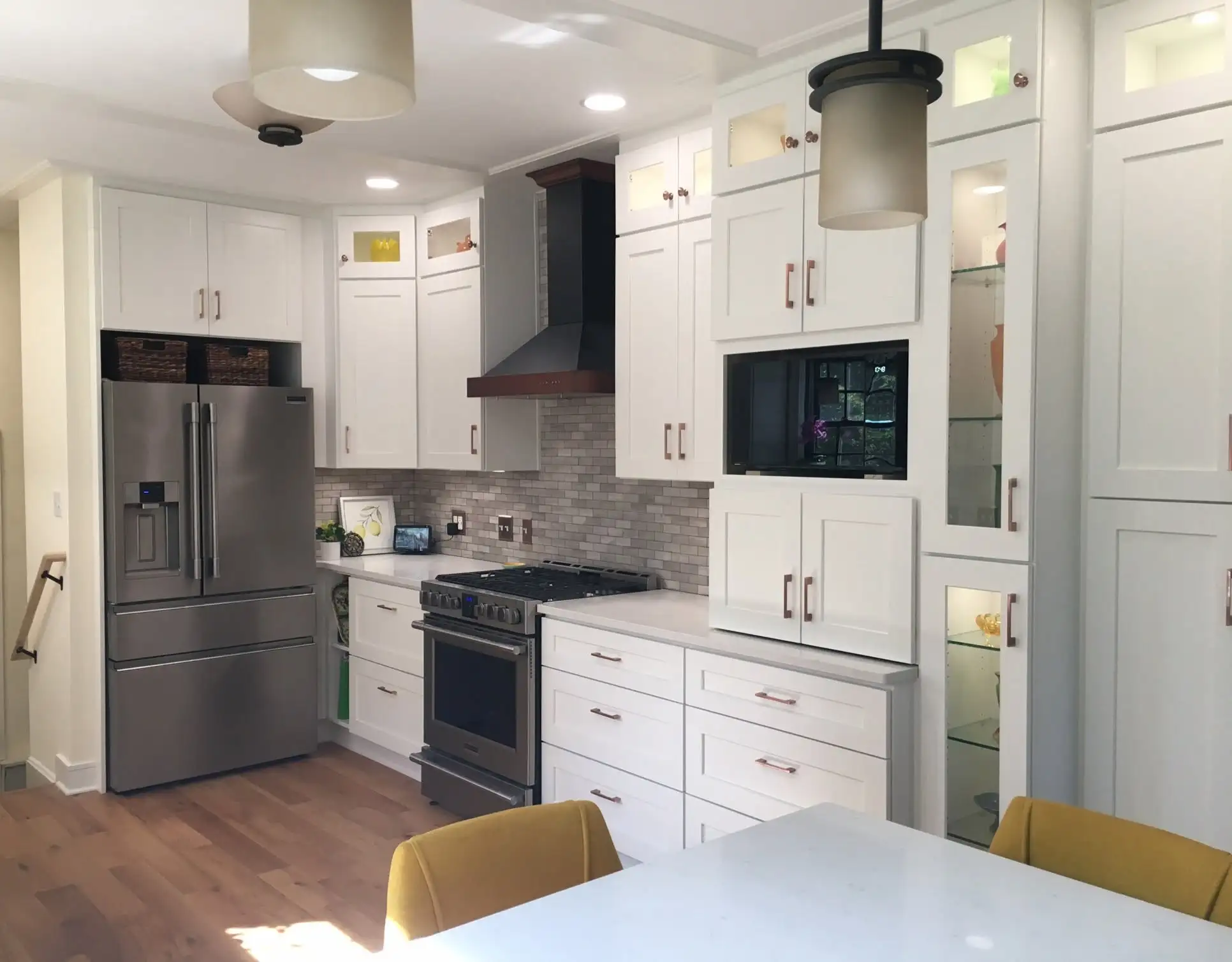 White kitchen cabinets with stainless appliances in a Parma Ohio kitchen remodel