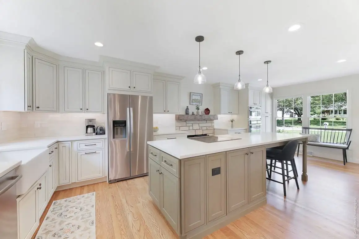 White cabinets and a large island in a Parma Ohio kitchen remodel