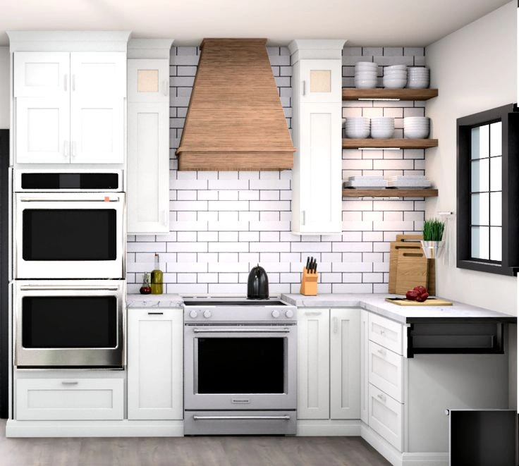 White kitchen cabinets with a wood range hood in a Bedford Ohio kitchen