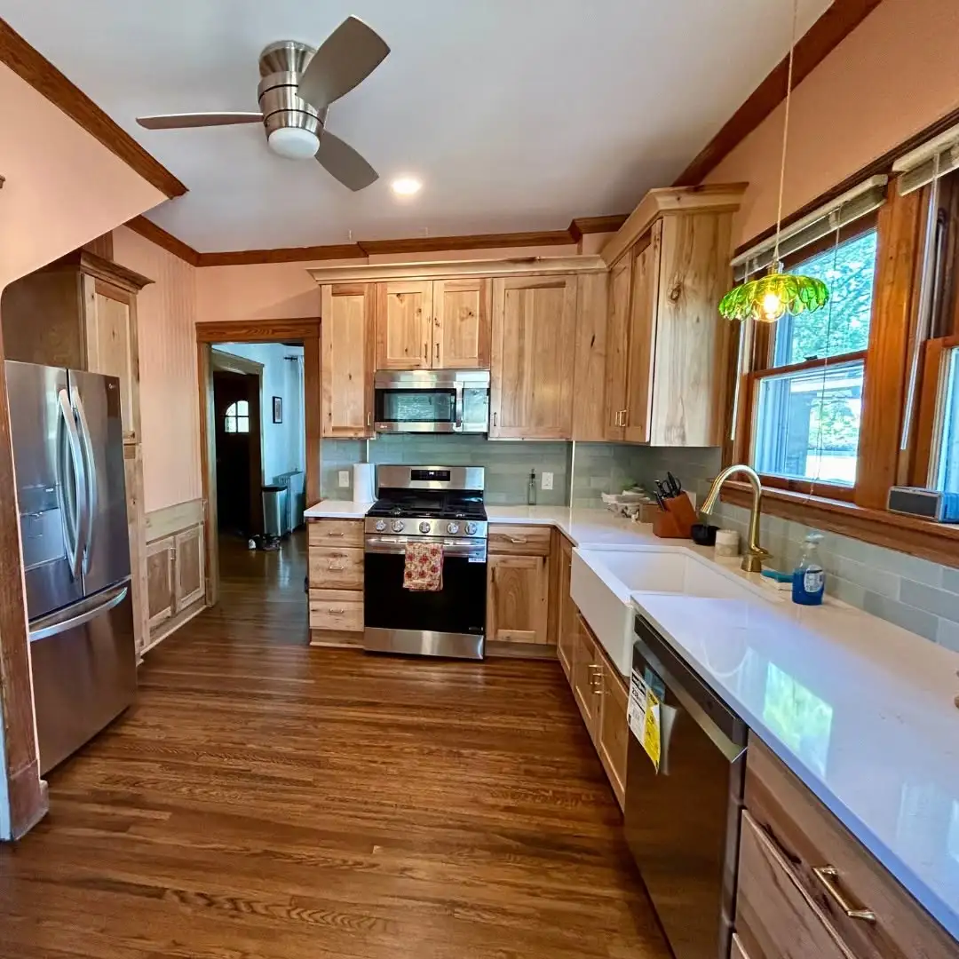Wood kitchen cabinets over hardwood floors in a Bedford Heights Ohio home